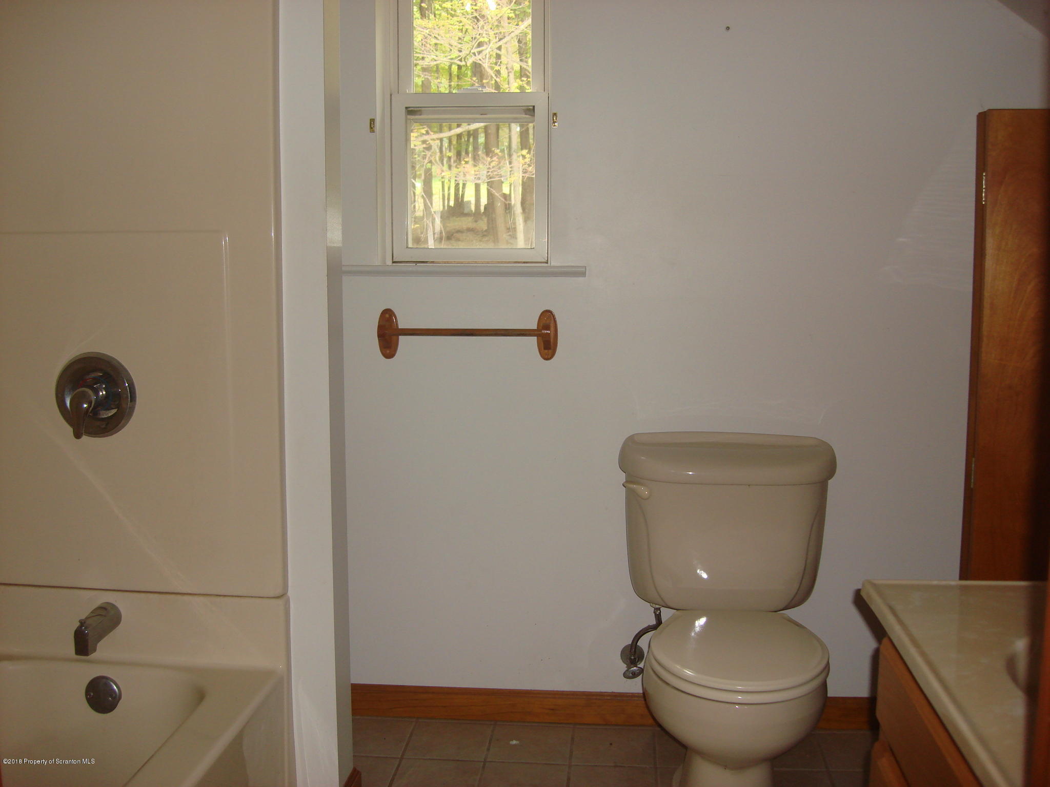 252 School House Road Tunkhannock, PA 18657 - Photo 15 of 20 a bathroom with a toilet and a sink