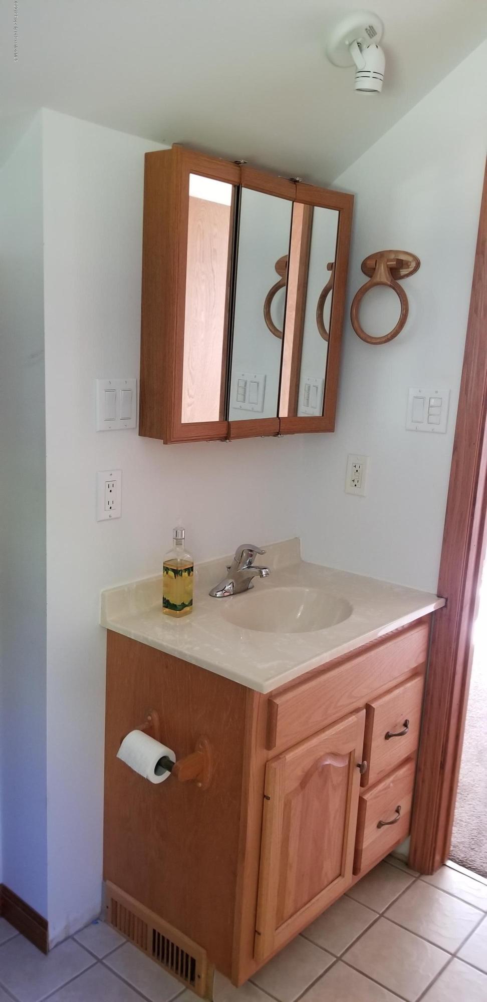 252 School House Road Tunkhannock, PA 18657 - Photo 16 of 20 a bathroom with a sink a vanity and a mirror
