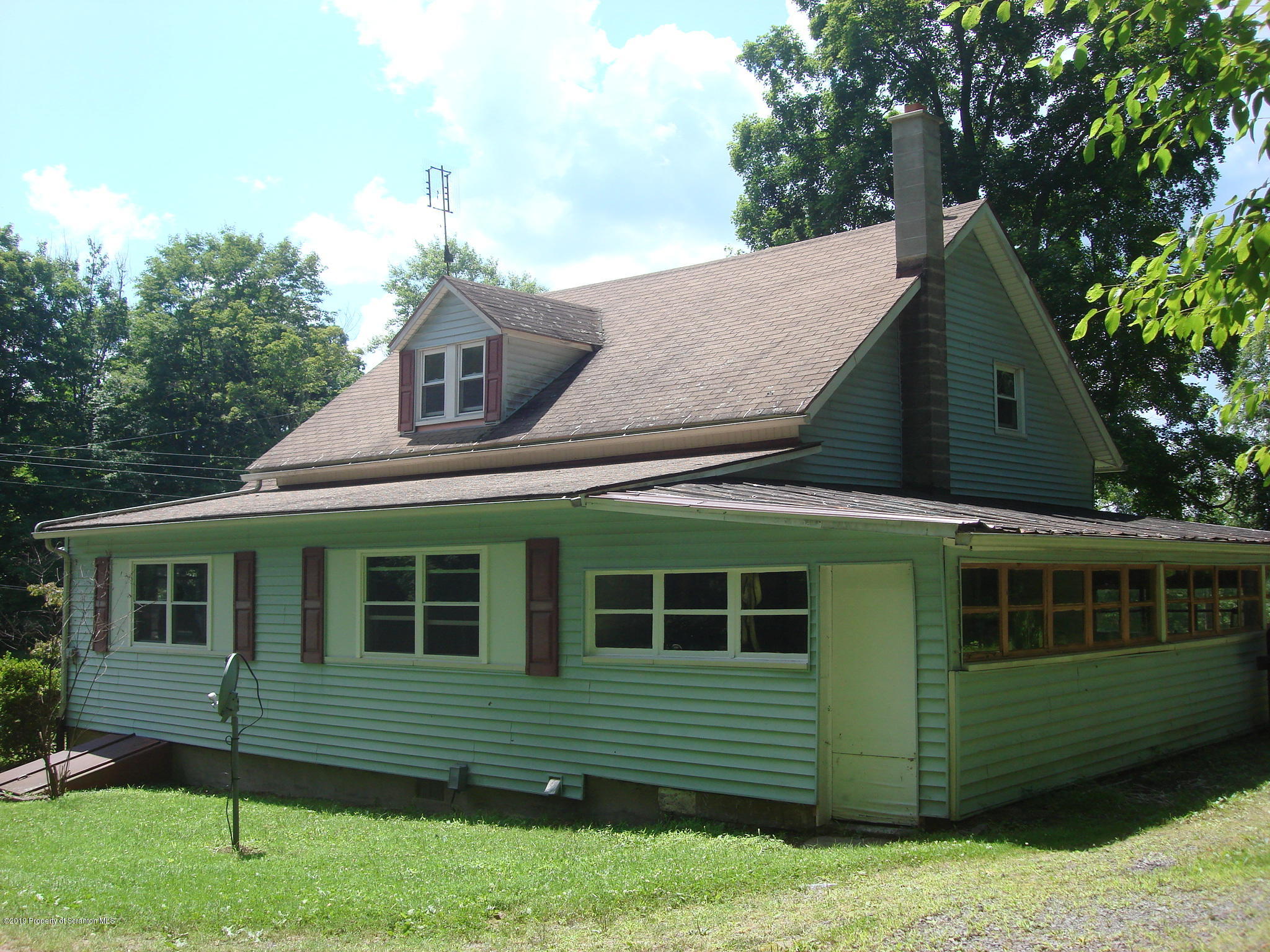 252 School House Road Tunkhannock, PA 18657 - Photo 2 of 20 a front view of a house with a garden