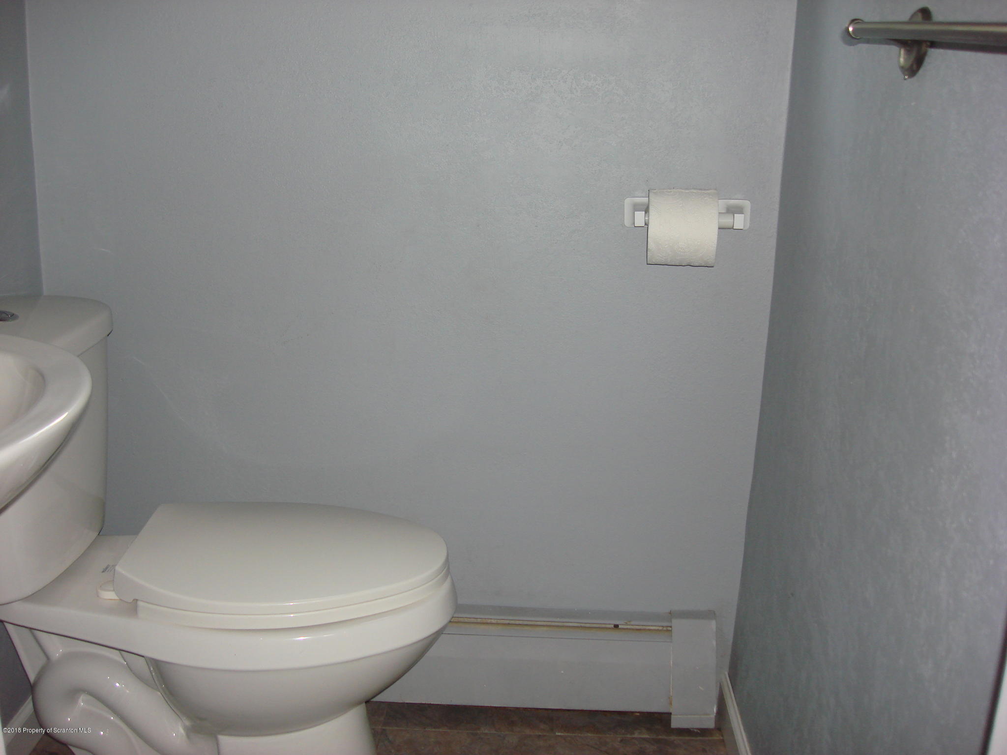 252 School House Road Tunkhannock, PA 18657 - Photo 9 of 20 a white toilet sitting next to a white sink