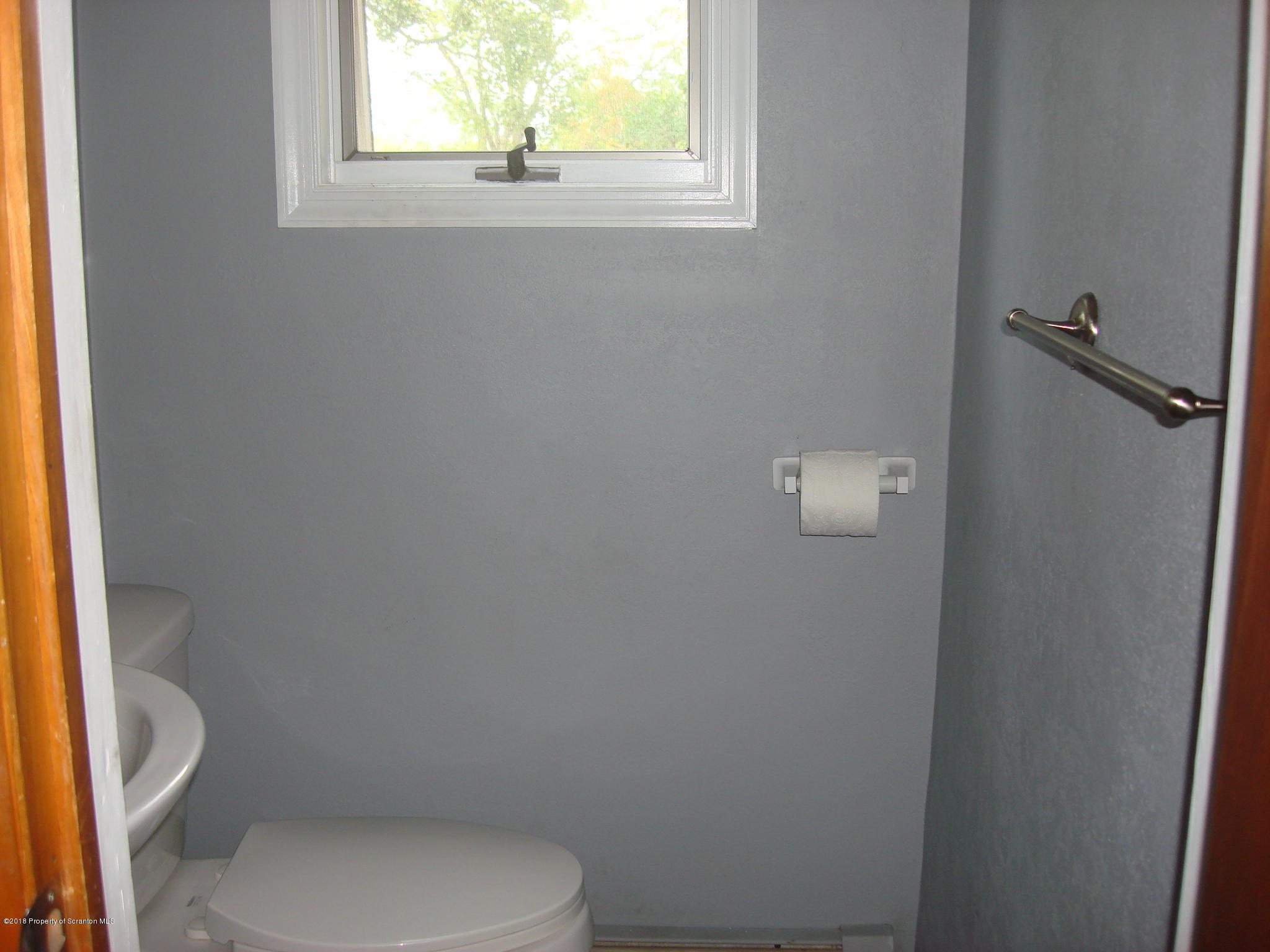 252 School House Road Tunkhannock, PA 18657 - Photo 10 of 20 a white toilet sitting next to a window