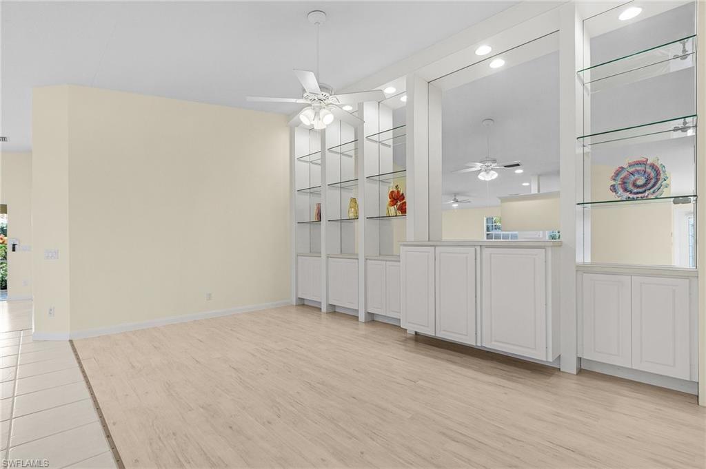 4187 St George Lane Naples, FL 34119 - Photo 11 of 27 Unfurnished dining area featuring light hardwood / wood-style floors