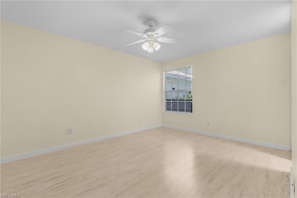 4187 St George Lane Naples, FL 34119 - Photo 13 of 27 Spare room with ceiling fan and light hardwood / wood-style flooring