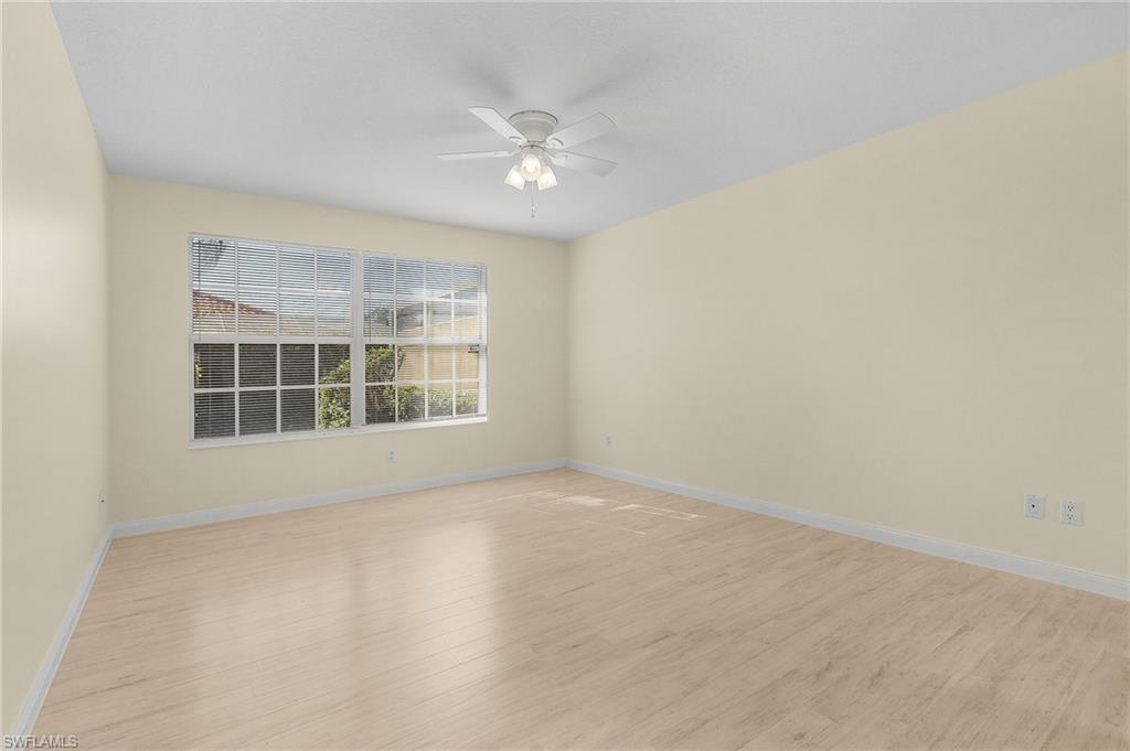 4187 St George Lane Naples, FL 34119 - Photo 16 of 27 Spare room featuring ceiling fan and light wood-type flooring