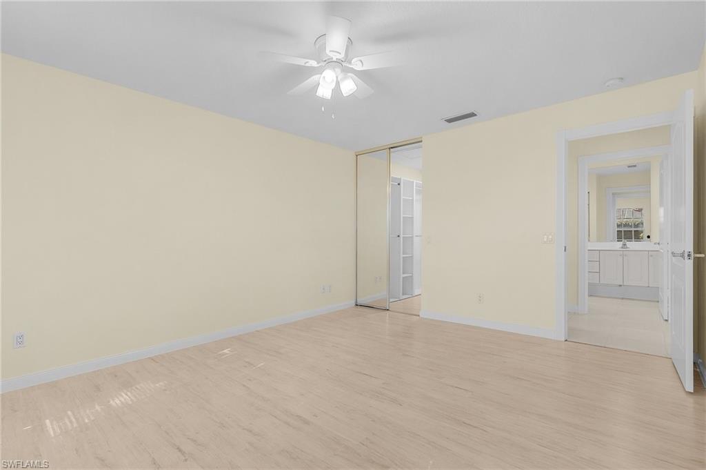 4187 St George Lane Naples, FL 34119 - Photo 17 of 27 Spare room with ceiling fan and light hardwood / wood-style flooring