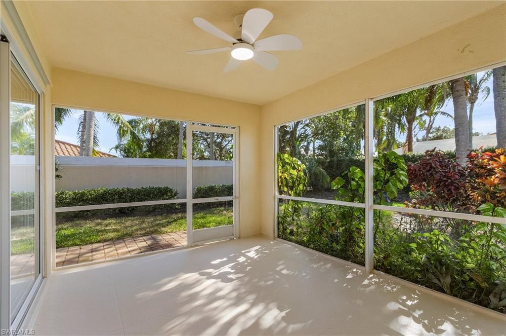 4187 St George Lane Naples, FL 34119 - Photo 22 of 27 Unfurnished sunroom with ceiling fan and a healthy amount of sunlight