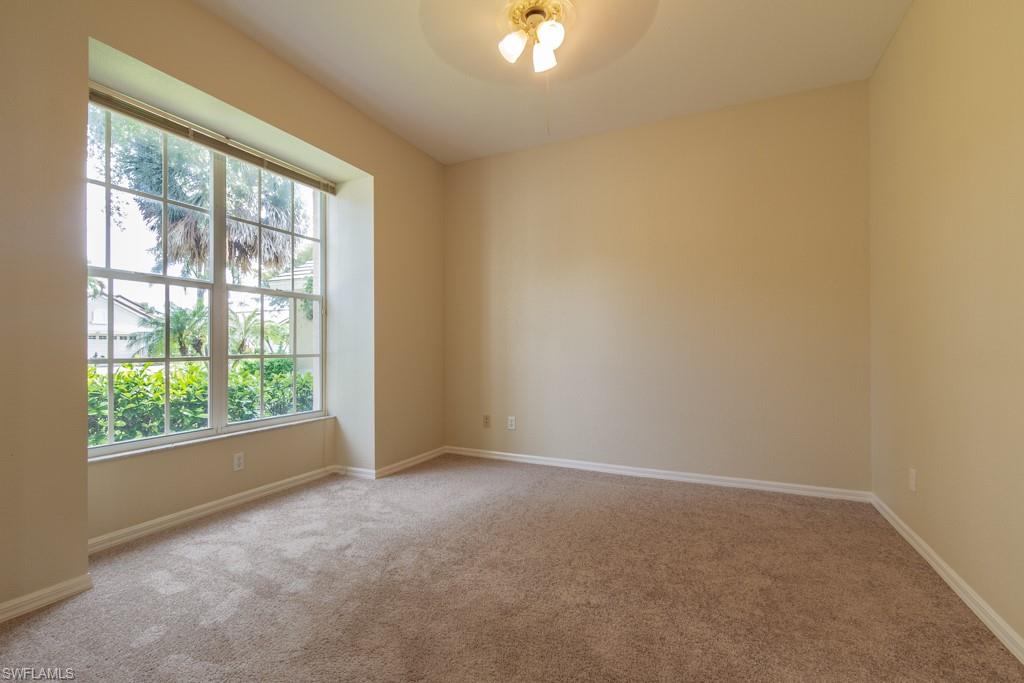 1869 Pondside Lane Naples, FL 34109 - Photo 13 of 35 a view of an empty room with a window