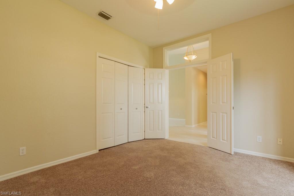 1869 Pondside Lane Naples, FL 34109 - Photo 14 of 35 a view of an empty room
