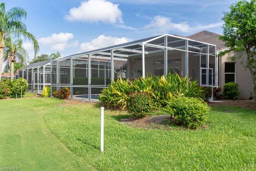 1869 Pondside Lane Naples, FL 34109 - Photo 21 of 35 a view of a house with backyard and garden