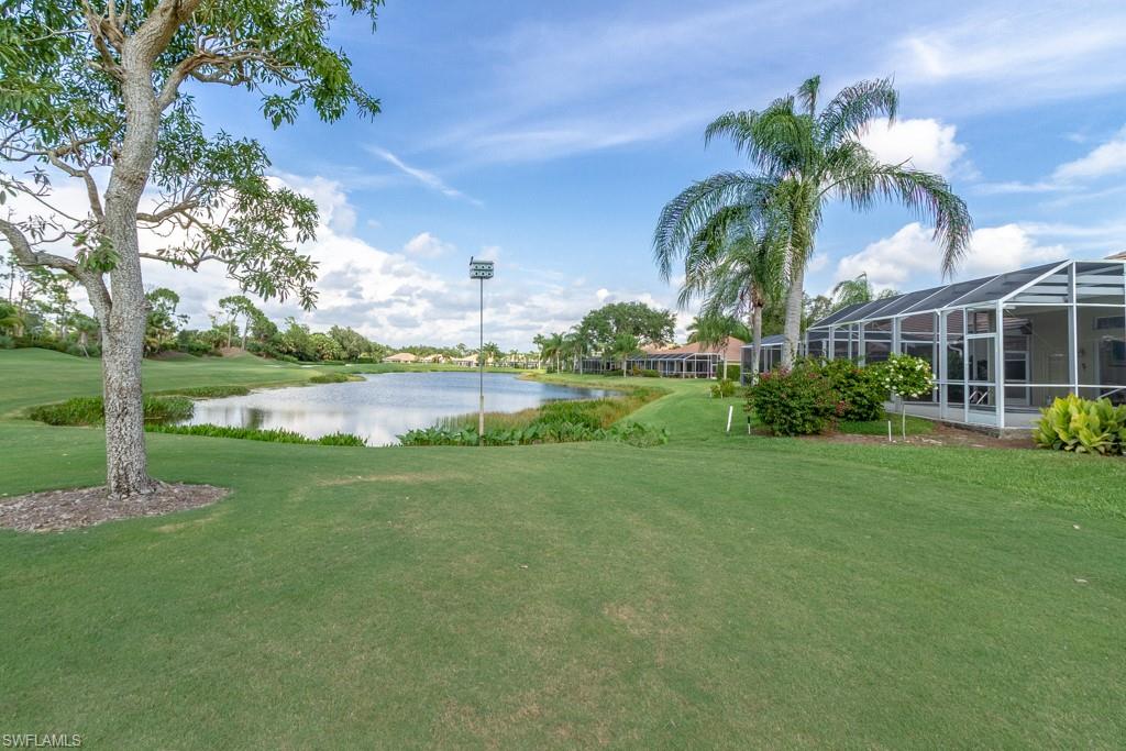 1869 Pondside Lane Naples, FL 34109 - Photo 23 of 35 a view of a garden with a house
