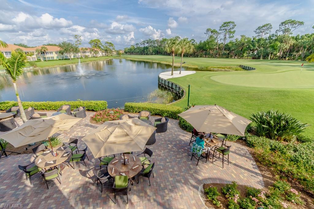 1869 Pondside Lane Naples, FL 34109 - Photo 28 of 35 an aerial view of a house with a garden and lake view