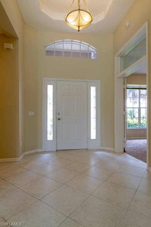 1869 Pondside Lane Naples, FL 34109 - Photo 3 of 35 a view of livingroom with front door