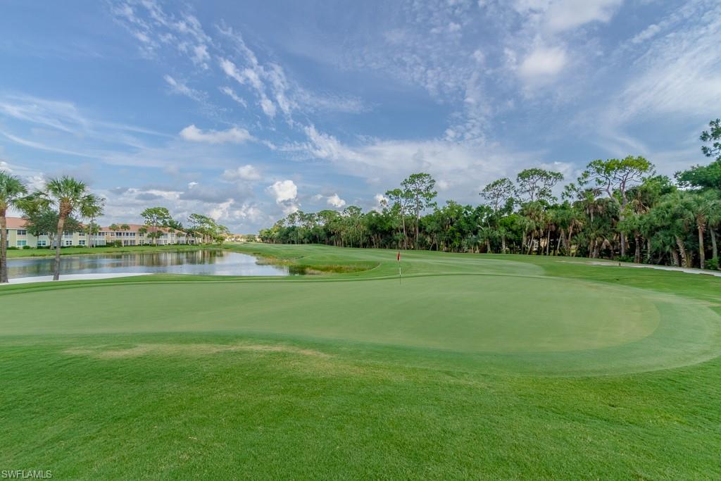 1869 Pondside Lane Naples, FL 34109 - Photo 32 of 35 a view of a golf course with a garden
