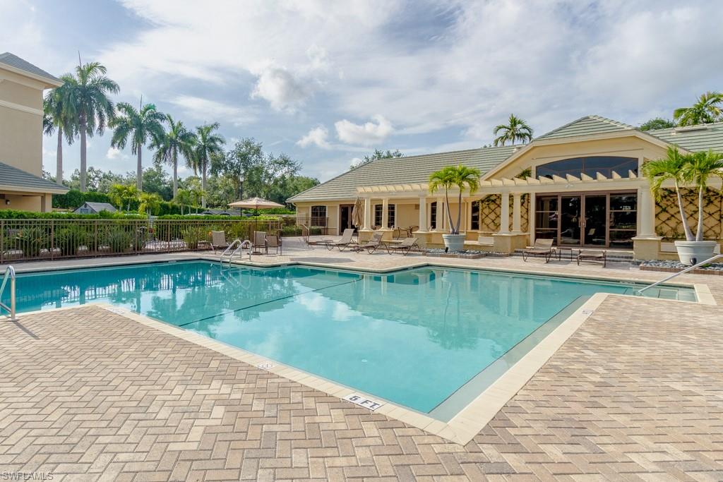 1869 Pondside Lane Naples, FL 34109 - Photo 34 of 35 a view of a swimming pool with a patio