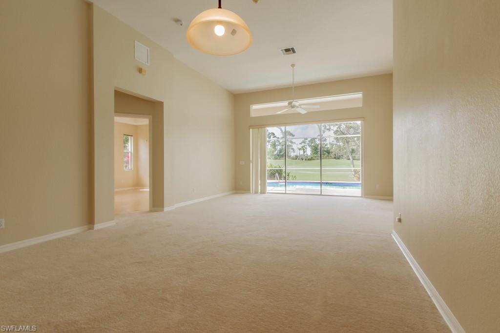 1869 Pondside Lane Naples, FL 34109 - Photo 4 of 35 an empty room with windows and view