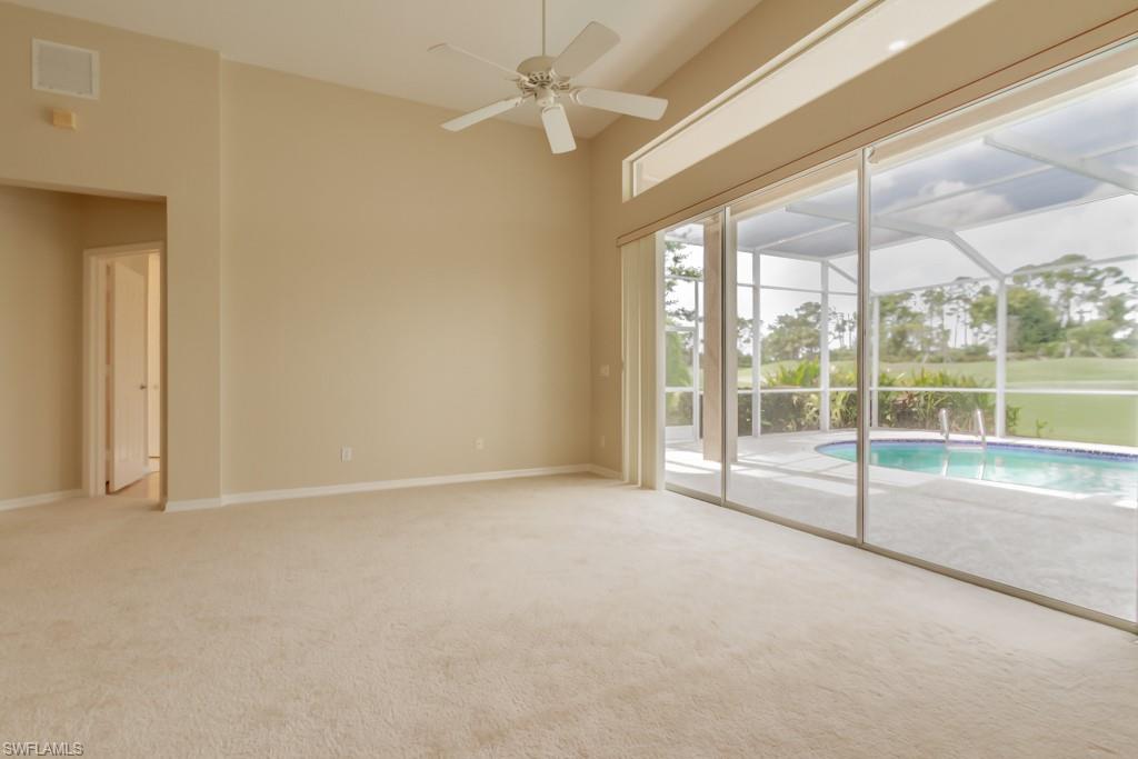 1869 Pondside Lane Naples, FL 34109 - Photo 5 of 35 a view of an empty room with a window