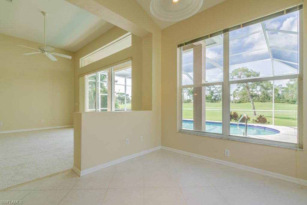 1869 Pondside Lane Naples, FL 34109 - Photo 9 of 35 a view of an empty room with a window