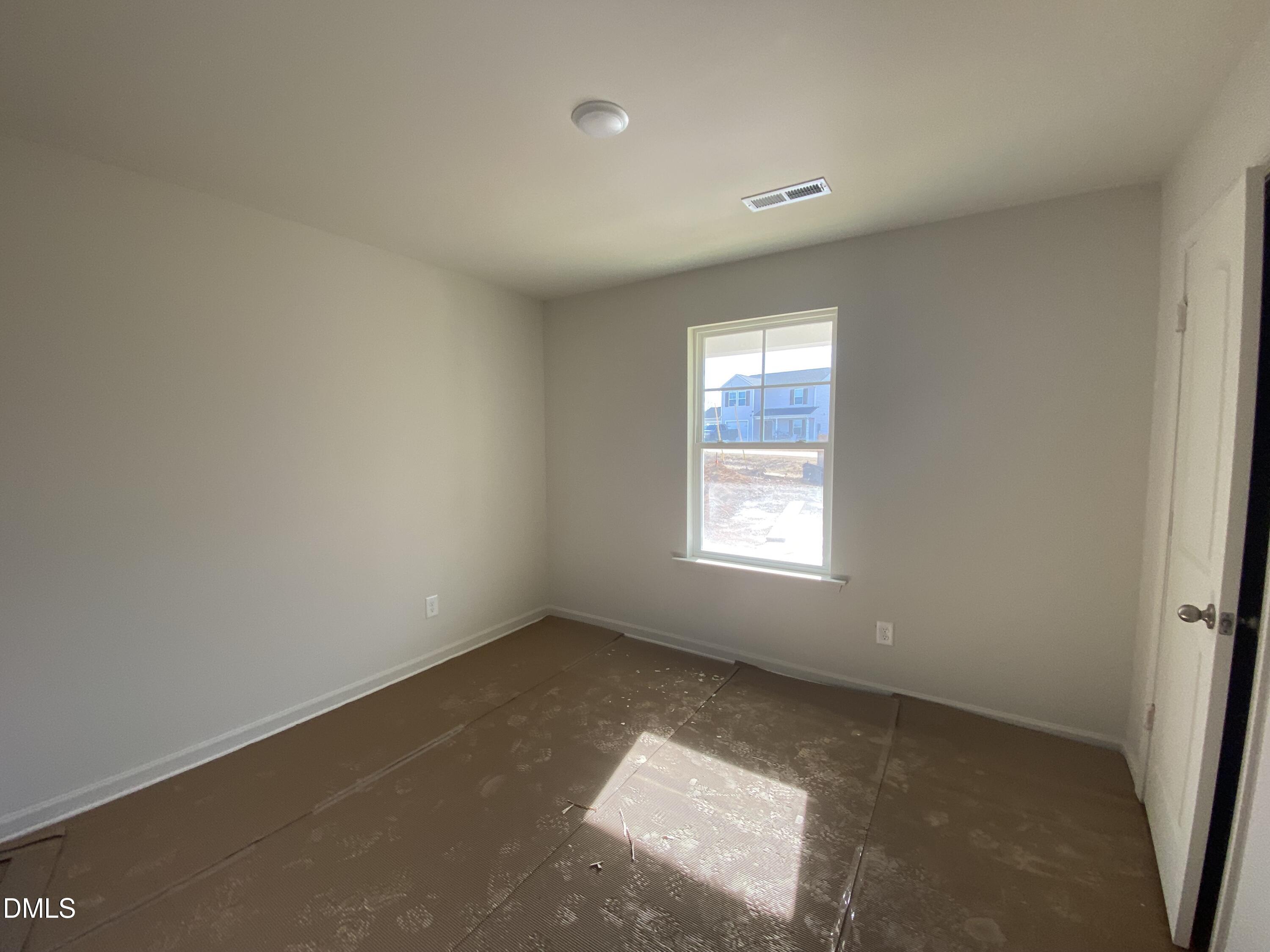 107 Slew Court Fremont, NC 27830 - Photo 12 of 16 an empty room with a window