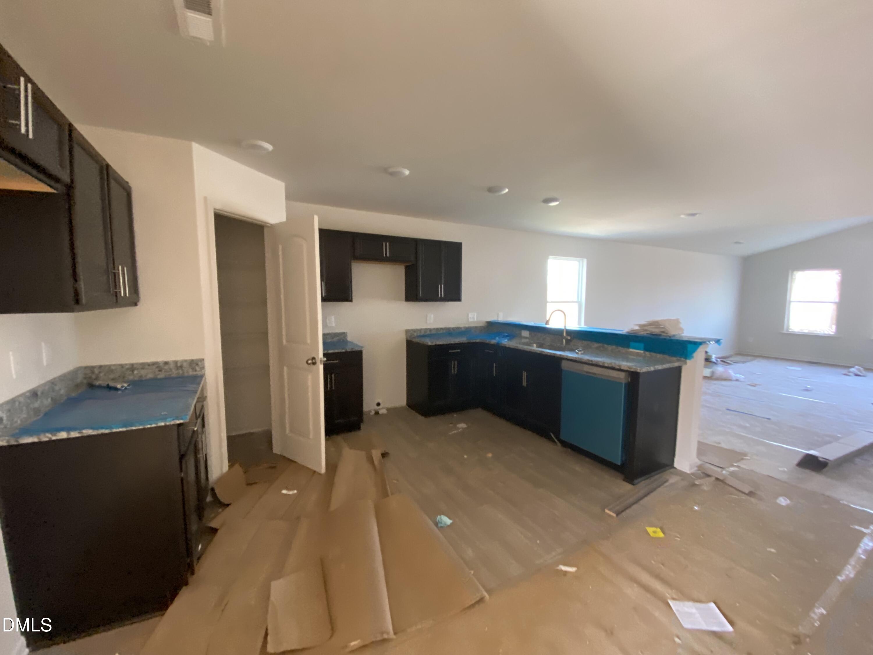 107 Slew Court Fremont, NC 27830 - Photo 3 of 16 a large kitchen with a large counter top stainless steel appliances and cabinets