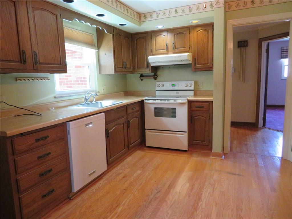 3701 Wayne Road Munhall, PA 15120 - Photo 12 of 20 Large kitchen with recess lighting, dishwasher, electric stove, disposal and refrigerator, with access to back yard