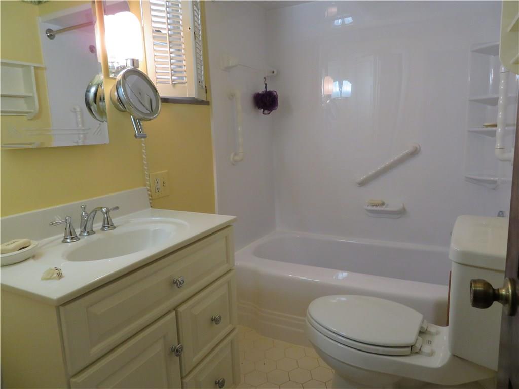 3701 Wayne Road Munhall, PA 15120 - Photo 15 of 20 Main bathroom with plantation shutters and ceramic tile flooring.