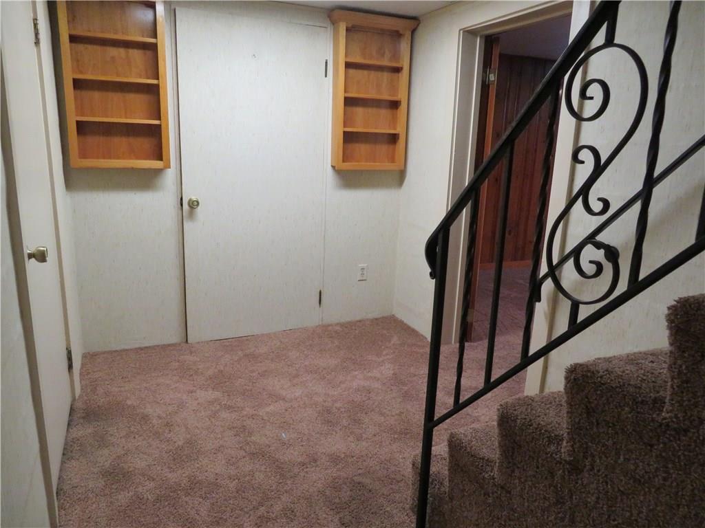 3701 Wayne Road Munhall, PA 15120 - Photo 16 of 20 Lower level hall to game room, wrought iron railing