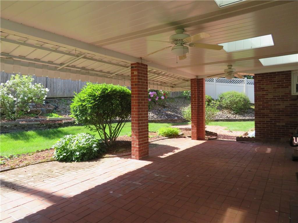 3701 Wayne Road Munhall, PA 15120 - Photo 3 of 20 Awesome back covered brick patio with (3) sky lights, ceiling fan, awning and perennials