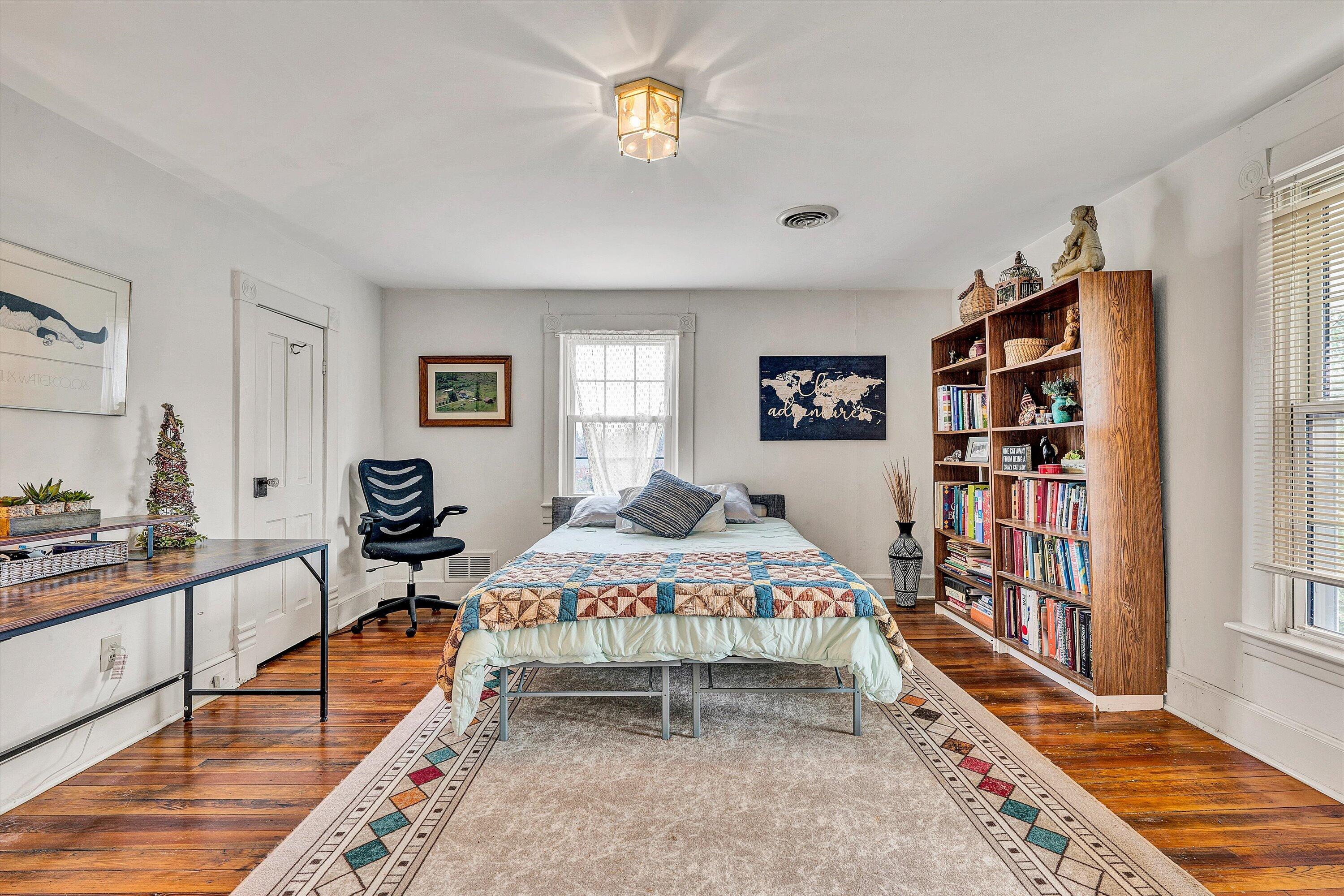 4015 Mud Lick Road Southwest Roanoke, VA 24018 - Photo 24 of 36 a bedroom with a bed furniture and a book shelf