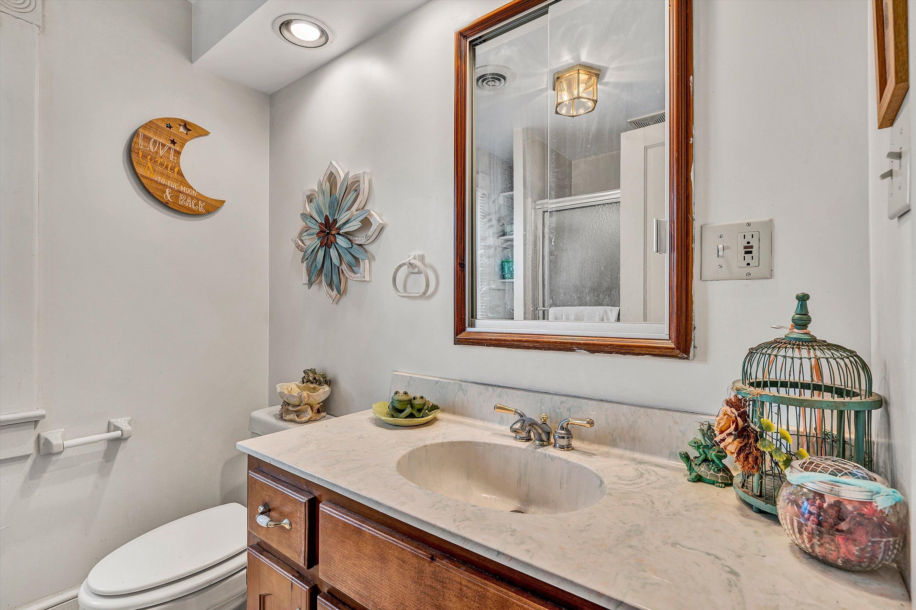 4015 Mud Lick Road Southwest Roanoke, VA 24018 - Photo 25 of 36 a bathroom with a sink vanity mirror and toilet