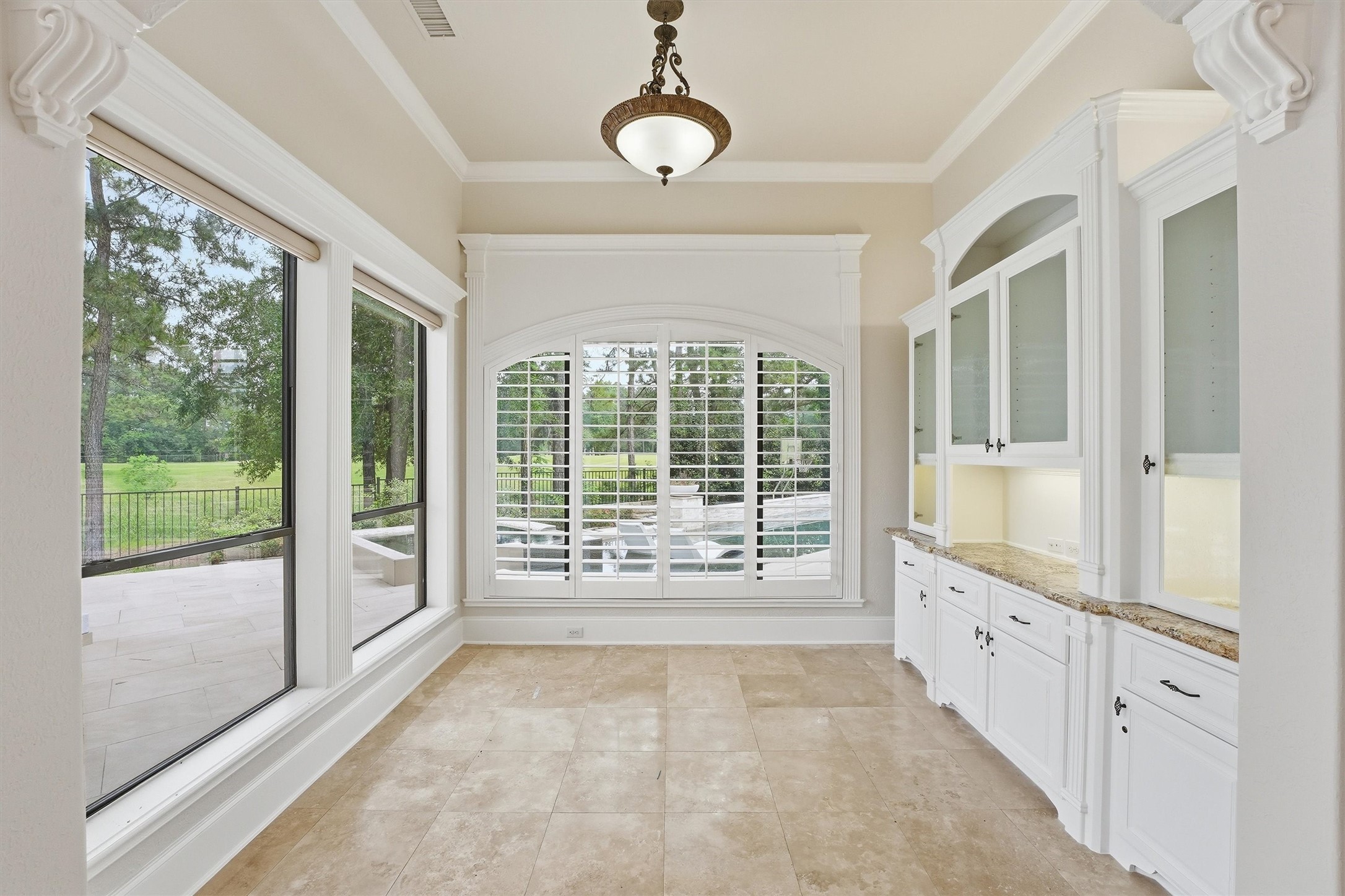 70 Quail Rock Place The Woodlands, TX 77381 - Photo 12 of 46 a view of an entryway with wooden floor and windows