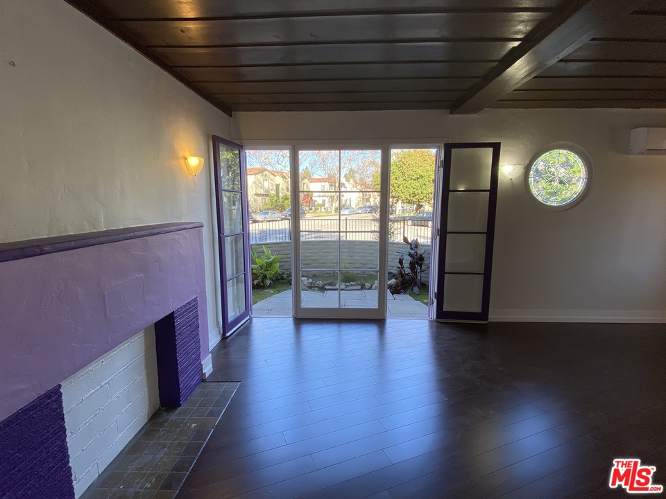 4247 9th Avenue Los Angeles, CA 90008 - Photo 14 of 45 a view of room with wooden floor and window