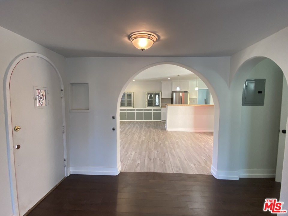 4247 9th Avenue Los Angeles, CA 90008 - Photo 17 of 45 a view of empty room with wooden floor and fan
