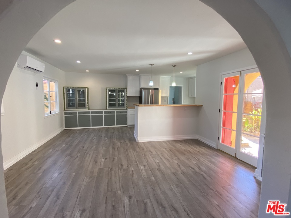 4247 9th Avenue Los Angeles, CA 90008 - Photo 18 of 45 a view of a big room with wooden floor and windows