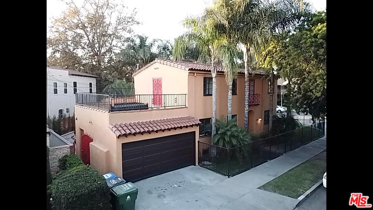 4247 9th Avenue Los Angeles, CA 90008 - Photo 2 of 45 a view of a house with a yard and tree s