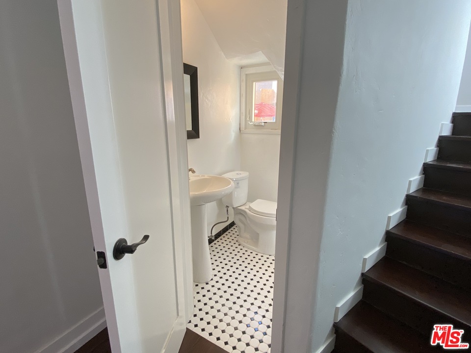 4247 9th Avenue Los Angeles, CA 90008 - Photo 24 of 45 a bathroom with a sink and a toilet