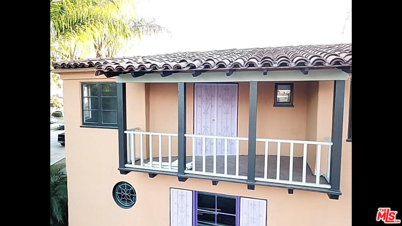 4247 9th Avenue Los Angeles, CA 90008 - Photo 30 of 45 a view of a house with a porch and a table