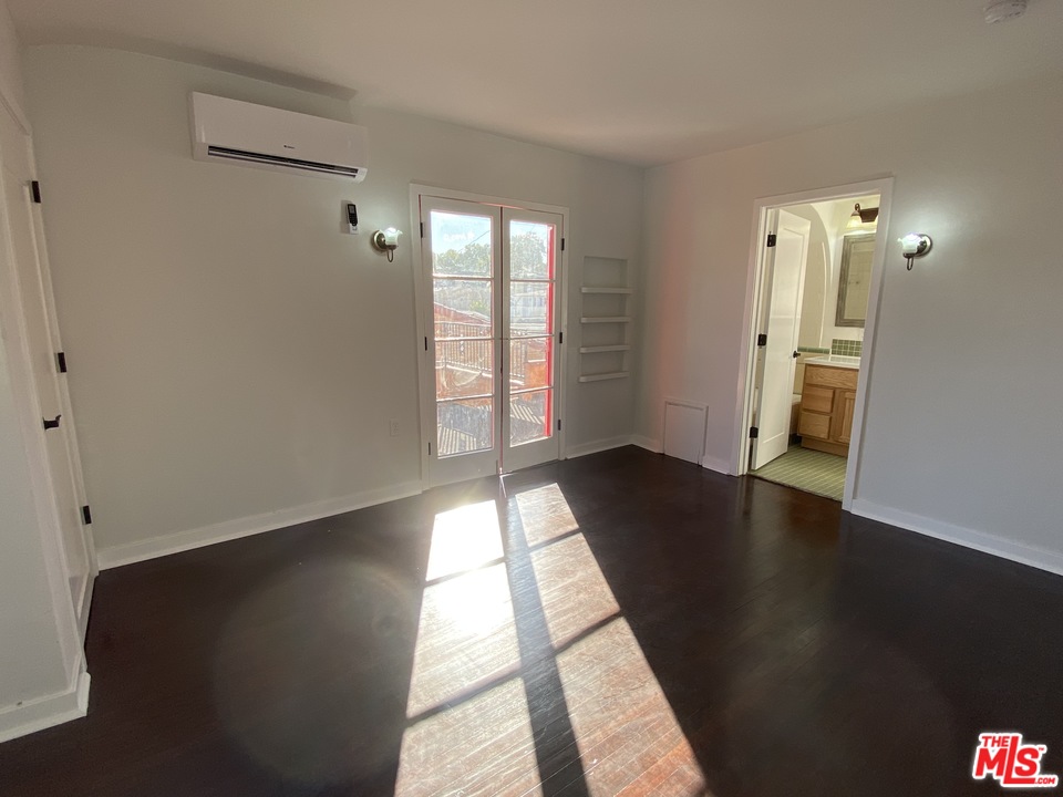 4247 9th Avenue Los Angeles, CA 90008 - Photo 34 of 45 wooden floor in an empty room with a window
