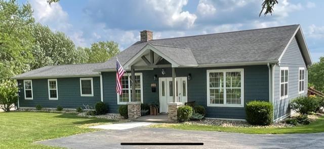 a front view of a house with garden