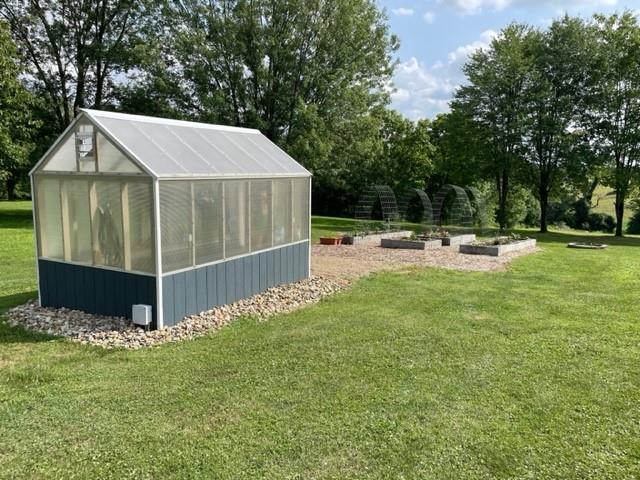 2149 Kingview Road Scottdale, PA 15683 - Photo 28 of 31 a view of a backyard with table and chairs and wooden fence