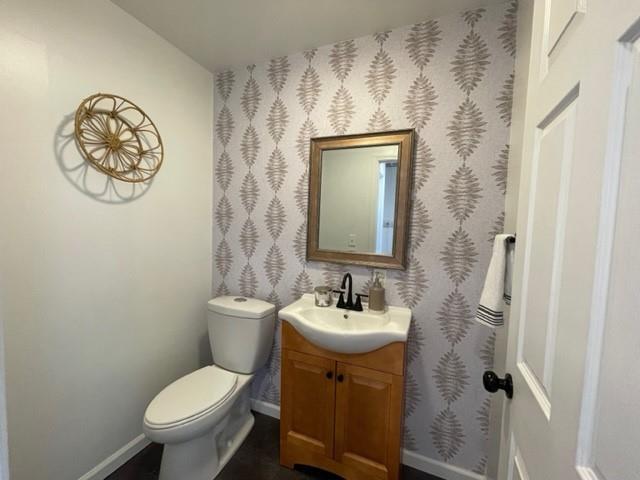 2149 Kingview Road Scottdale, PA 15683 - Photo 9 of 31 a bathroom with a toilet sink and mirror