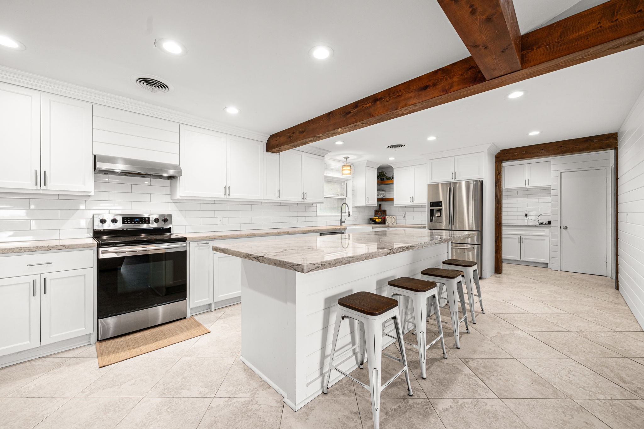 3148 FM 333 Road Garwood, TX 77442 - Photo 14 of 50 a kitchen with stainless steel appliances kitchen island granite countertop a sink and cabinets