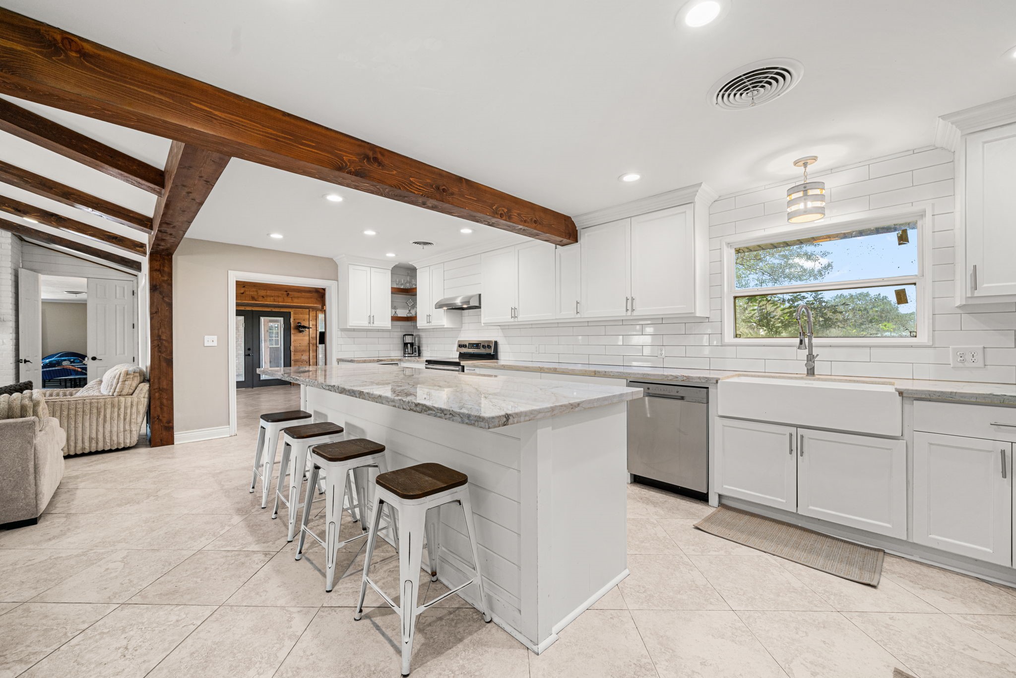 3148 FM 333 Road Garwood, TX 77442 - Photo 15 of 50 a kitchen with sink cabinets and dining table