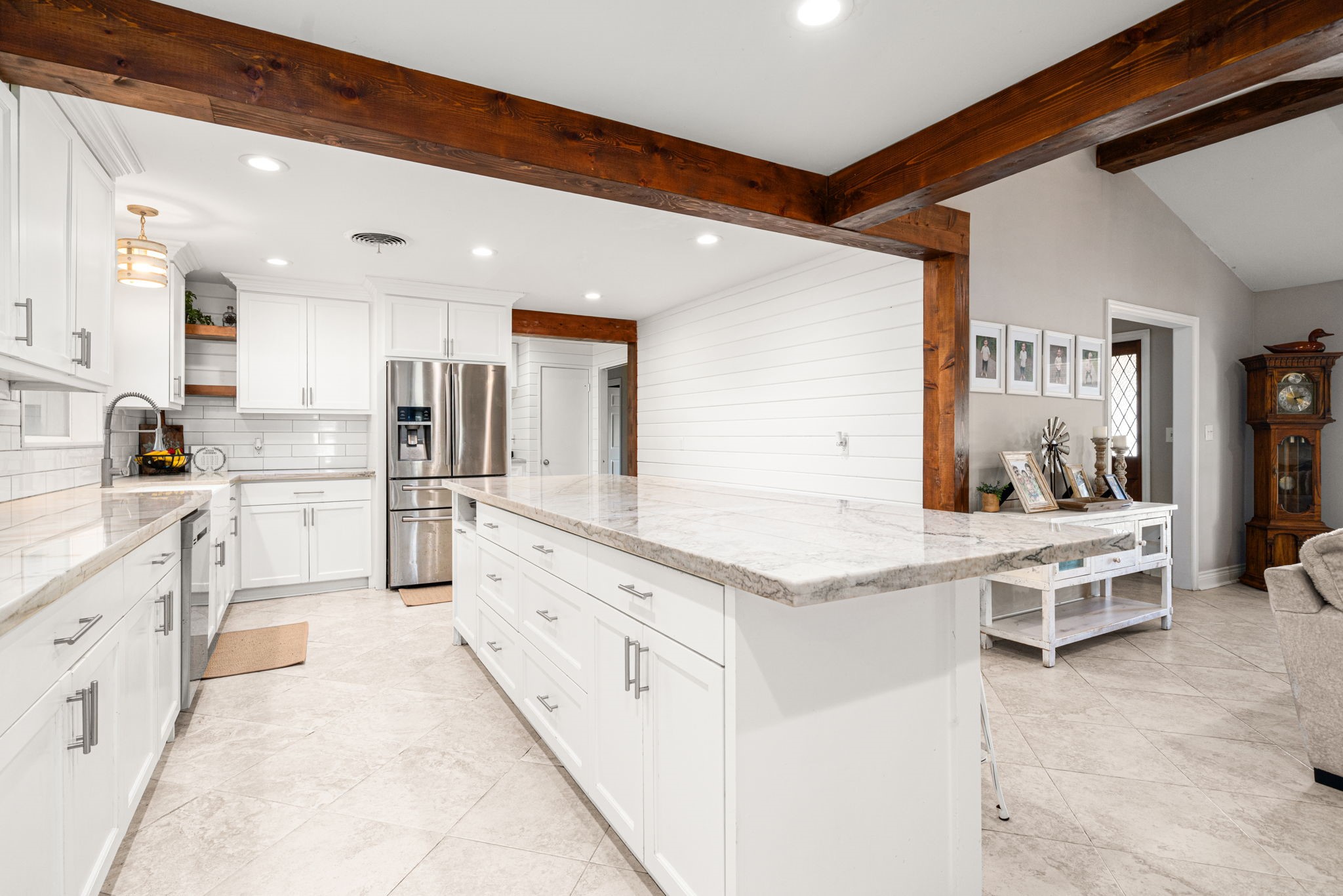 3148 FM 333 Road Garwood, TX 77442 - Photo 17 of 50 a large white kitchen with cabinets and chairs