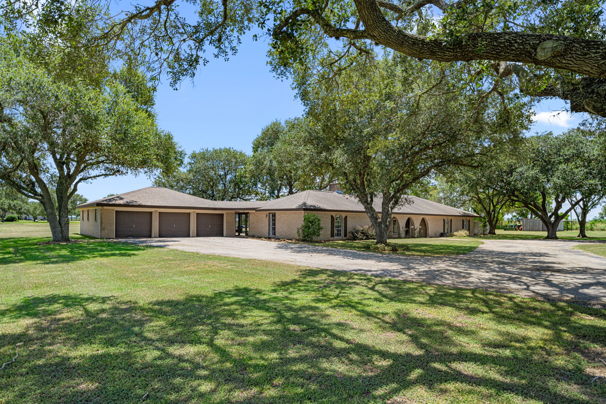3148 FM 333 Road Garwood, TX 77442 - Photo 2 of 50 a front view of a house with a yard and trees