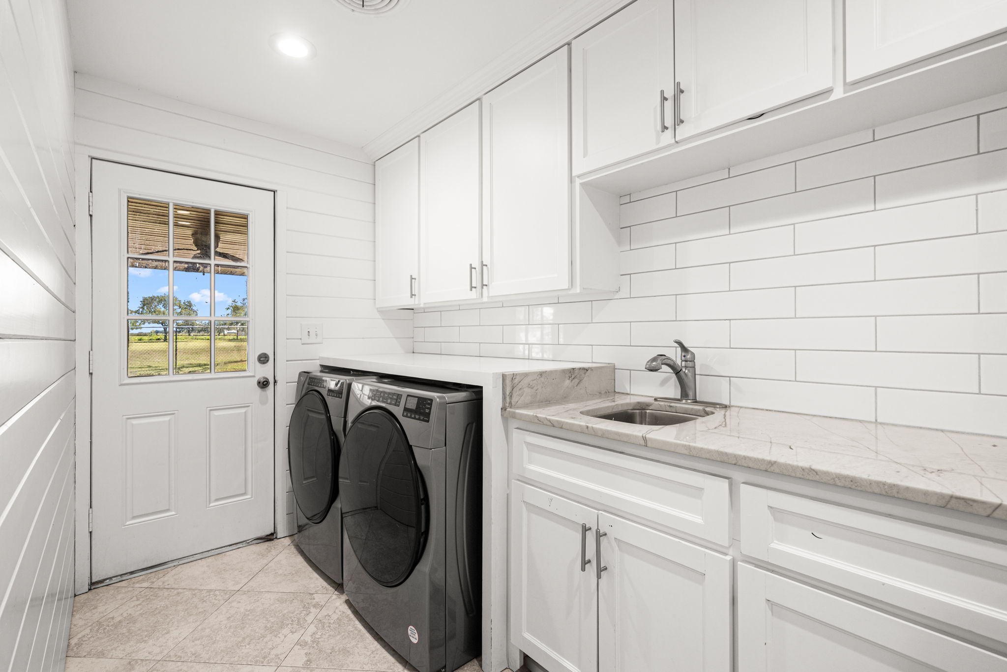 3148 FM 333 Road Garwood, TX 77442 - Photo 23 of 50 a close view of a sink and a washer dryer