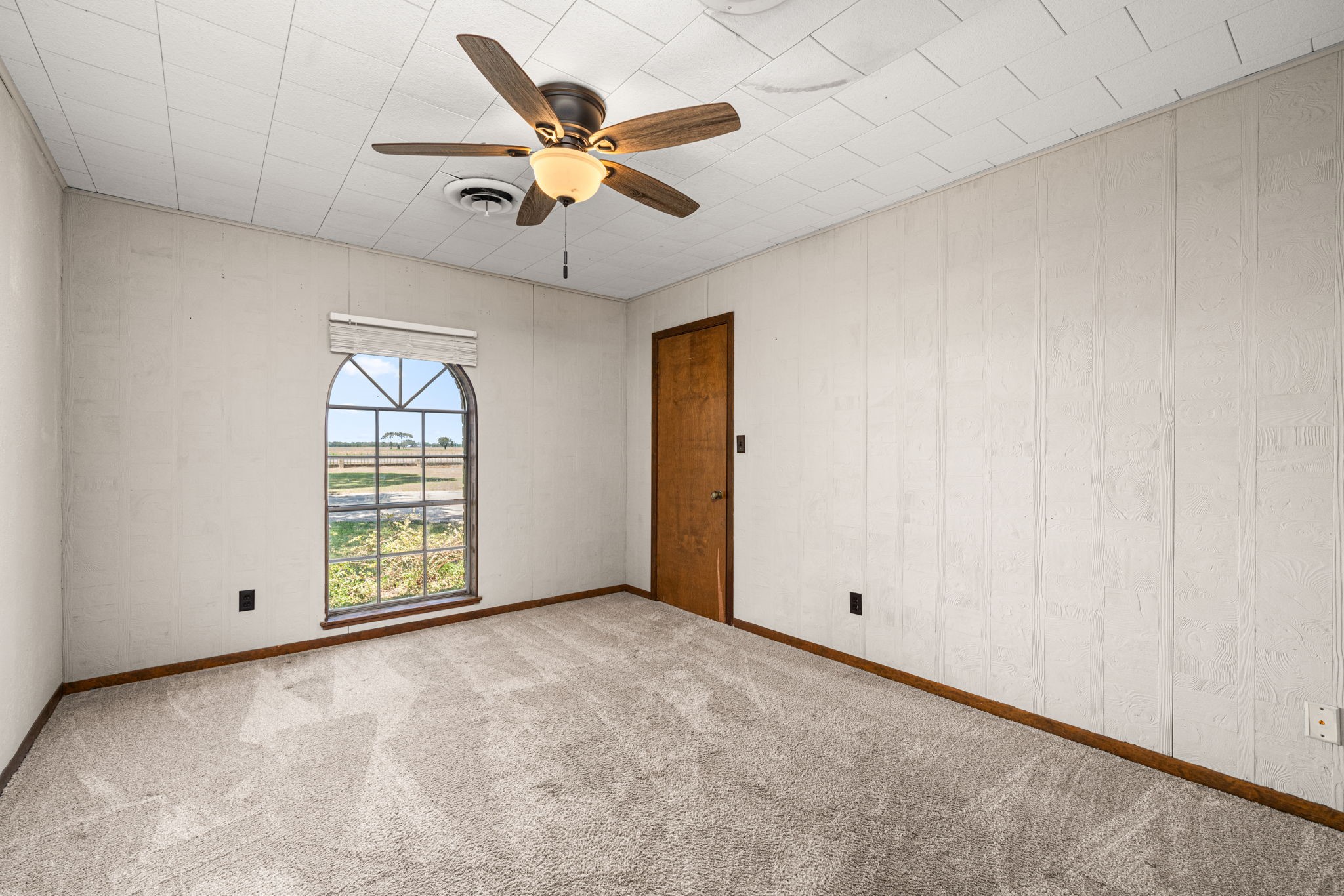 3148 FM 333 Road Garwood, TX 77442 - Photo 24 of 50 a view of an empty room with a window