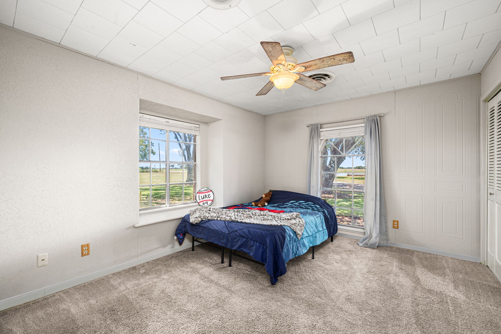 3148 FM 333 Road Garwood, TX 77442 - Photo 25 of 50 a bedroom with a bed and a window