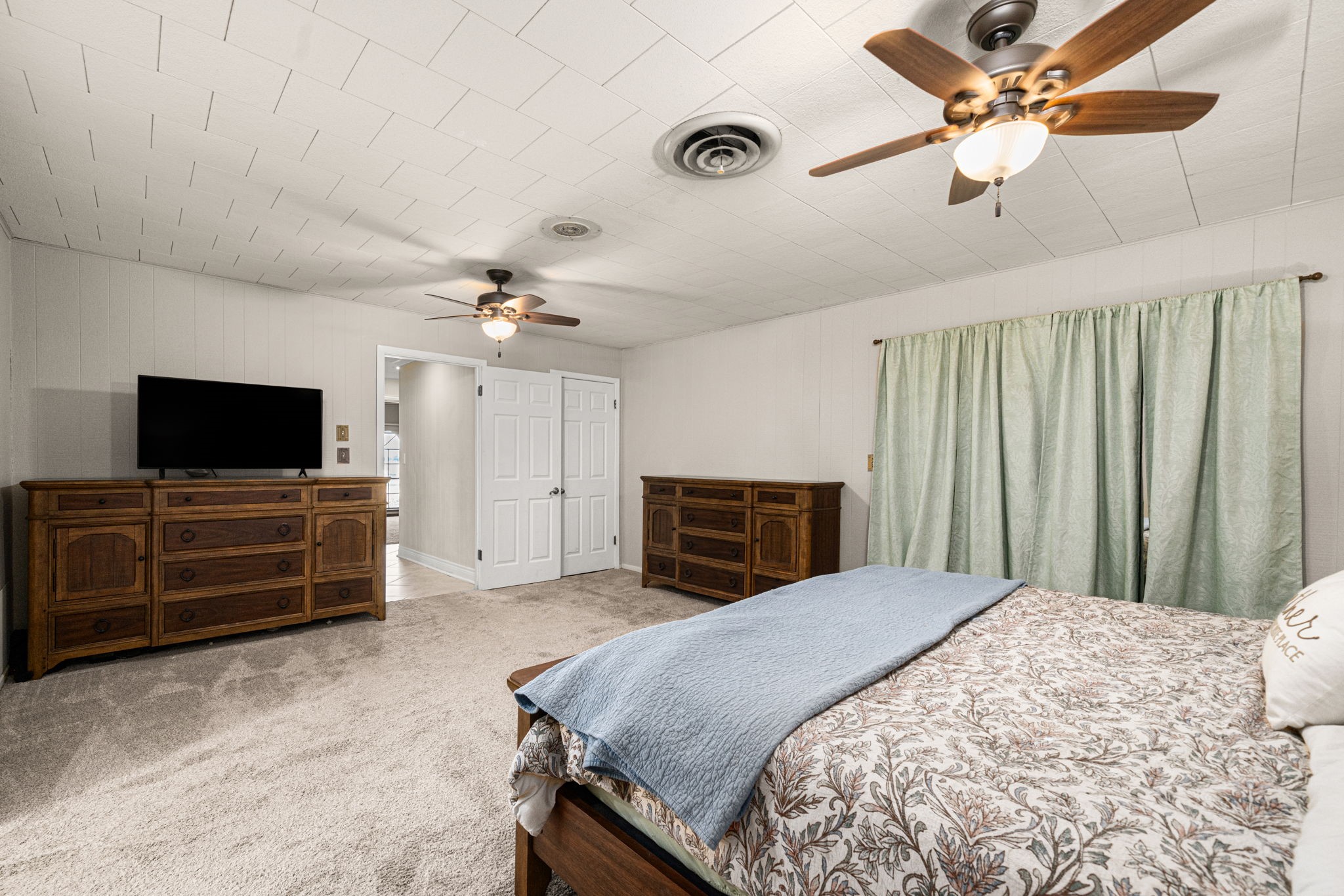 3148 FM 333 Road Garwood, TX 77442 - Photo 29 of 50 a bedroom with a bed and a flat screen tv