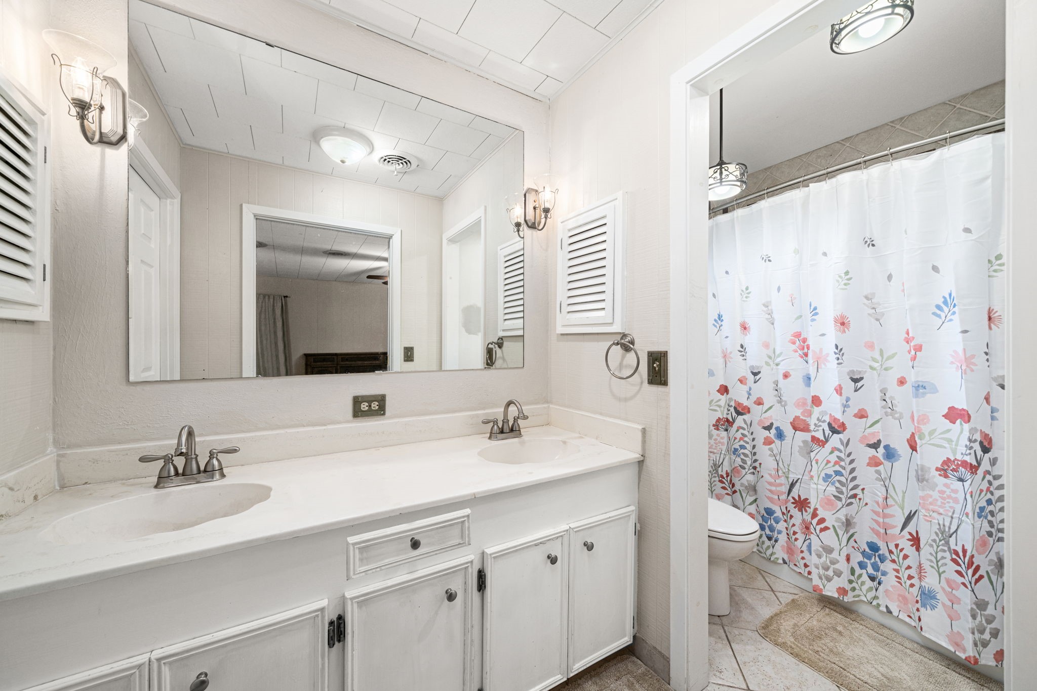 3148 FM 333 Road Garwood, TX 77442 - Photo 30 of 50 a bathroom with a double vanity sink mirror double and shower