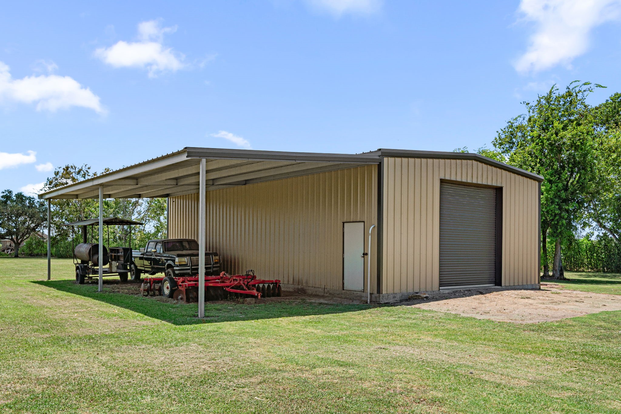 3148 FM 333 Road Garwood, TX 77442 - Photo 36 of 50 a backyard of a house with childrens swings and slides